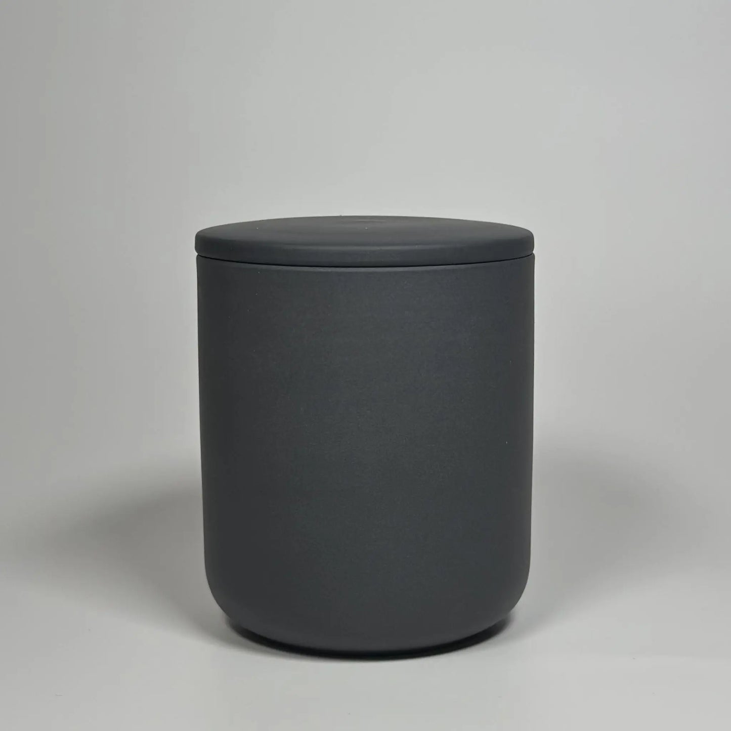 Warm woods and cashmere sandalwood ceramic jar candle, front view, luxury soy wax scented candle