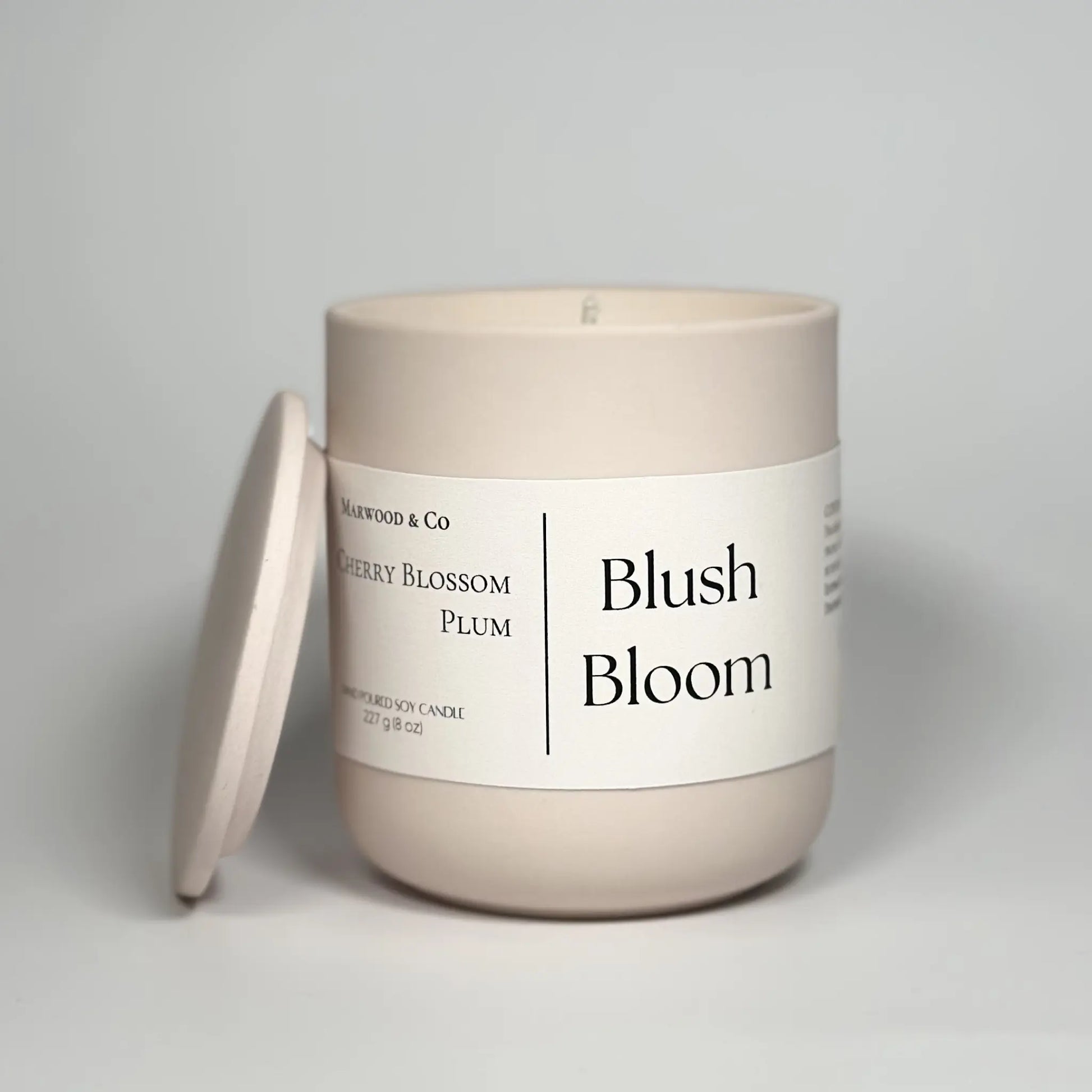 Cherry blossom ceramic jar candle, frontal view, hand-poured soy wax, best scented candles for home, luxury fragrance, long-burning decorative candle